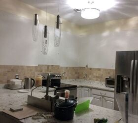 Tired of her too-tall kitchen cabinets, this woman replaced them with something wild