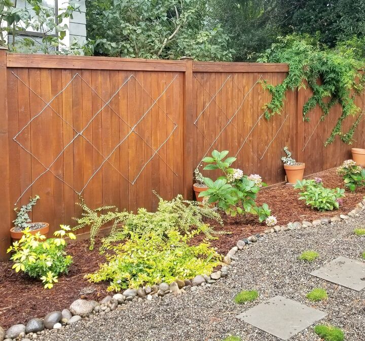 s 18 easy landscaping ideas that you ll absolutely love, Make a curvy woodland flower bed