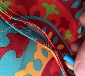 She cuts open a water-resistant placemat for this smart, 30-minute porch hack