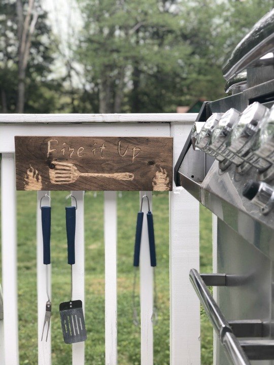 s 15 ideas for people who are serious about their backyard bbqs, An engraved utensil organizer sign