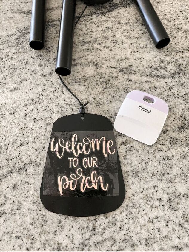 easy wind chime refresh, I use the Cricut Scraper tool to smooth it out and make sure it sticks on there well