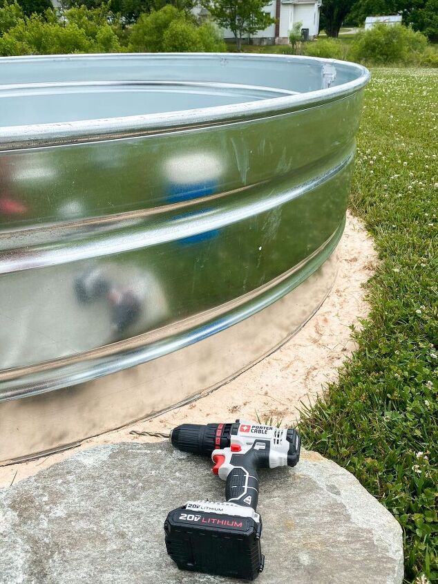 diy stock tank pool, Here is the first hole we drilled into the pool