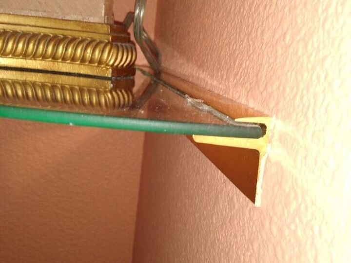 q howbto remove corner glass shelf in metal bracket