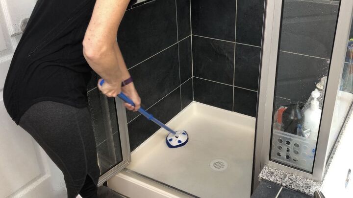 s 13 essential bathroom cleaning tips that will change your life, Clean your shower with an extendable scrubber