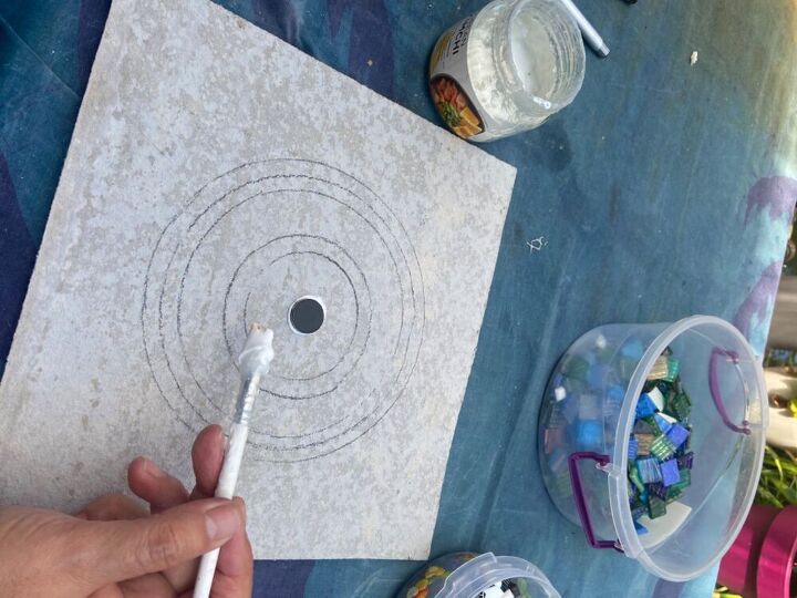 how to create a mosaic mandala for your garden, Glue centre tile