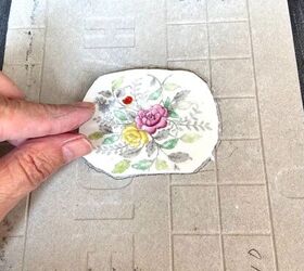 how to create a pretty mosaic using broken mirror and old crockery, Glue in place