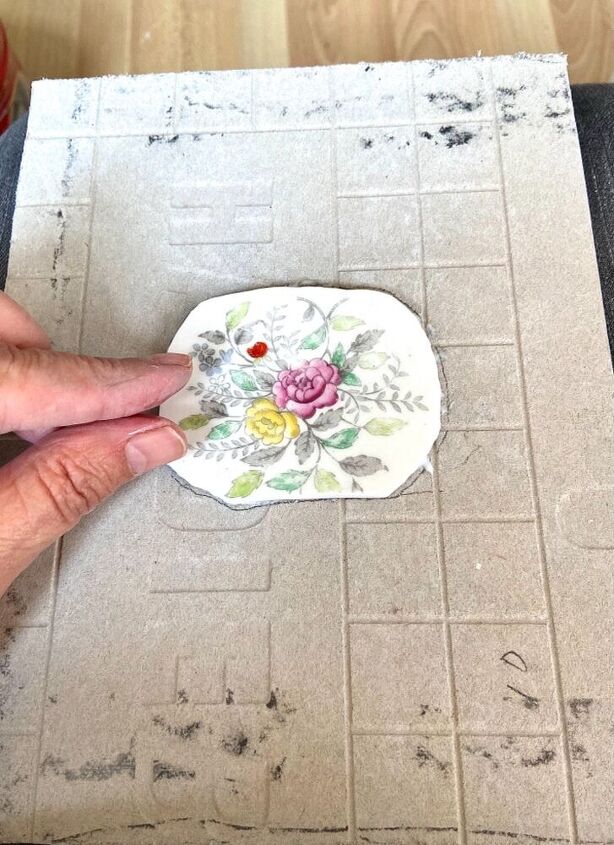 how to create a pretty mosaic using broken mirror and old crockery, Glue in place