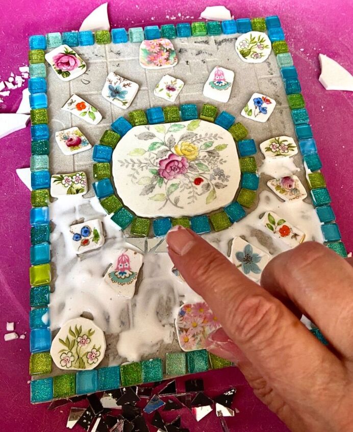 how to create a pretty mosaic using broken mirror and old crockery, Glue pieces in