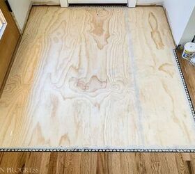 They lay plywood in their entryway for this stunning flooring boost