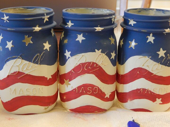 s 13 new patriotic decor ideas to add to your home this week, These festive Mason jar candleholders