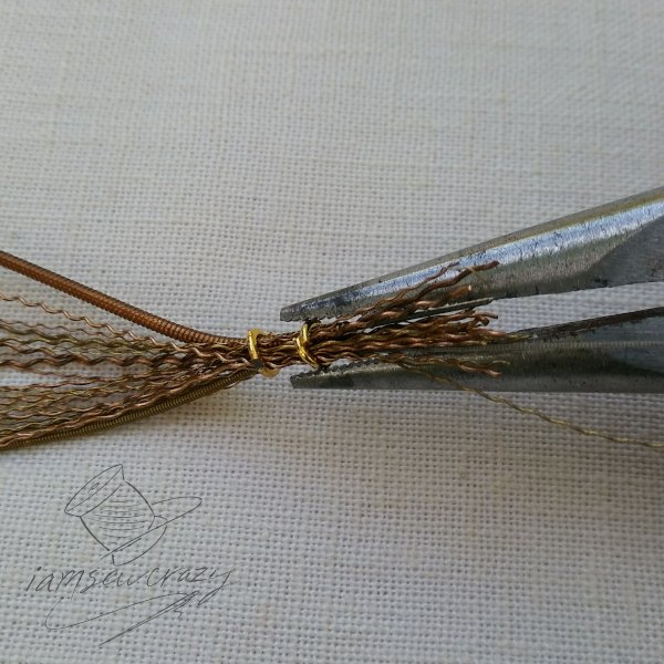 make your own upcycled lily sculpture out of guitar strings
