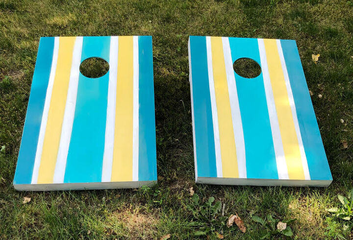 s 25 backyard ideas that ll make your kids summer, These brightly painted cornhole boards