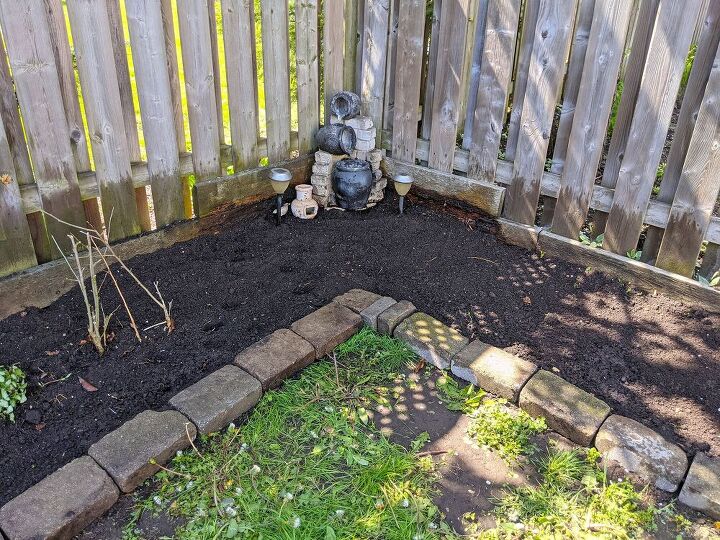 how i expanded my backyard growing space more veggies, Leveling out the soil