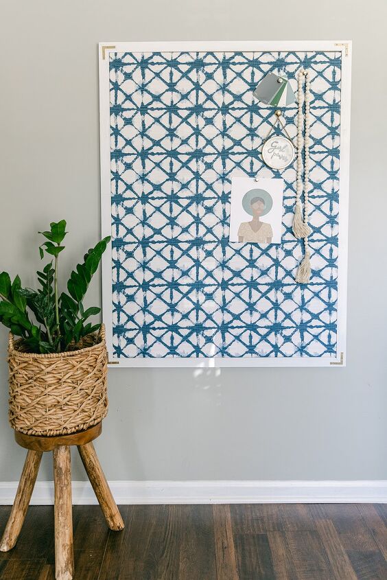 s 14 things you can diy for cheap instead of buying overpriced wall art, Cover a corkboard with patterned fabric