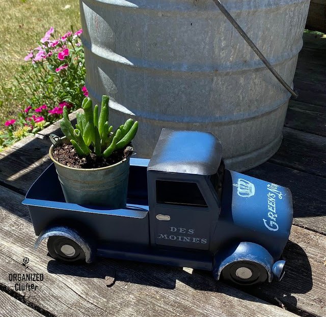 a dollar general blue truck with decor transfers and a succulent