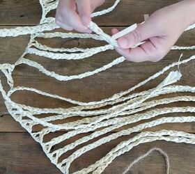 Braid the strands of a Dollar Tree grass skirt to copy this high-end storage hack (for $1)