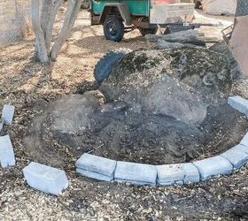 She lays pavers around a giant boulder to create this breathtaking outdoor space