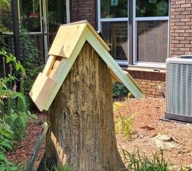 She sticks wood slabs on a tree trunk for this super simple way to create some outdoor magic