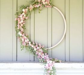 s 15 awesome summer wreaths that will make your front door look so cute, A flowing flower wreath