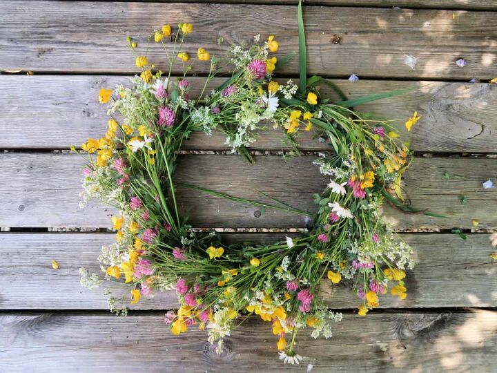 s 15 awesome summer wreaths that will make your front door look so cute, A pretty wildflower wreath