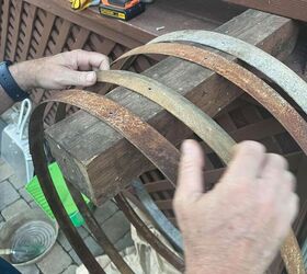 After a fire, they turn leftover barrel rings into something beautiful for their new garden