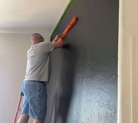 They start by painting the wall black—$100 later, it's incredible!