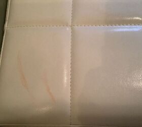 q how do i remove a food stain from a white faux leather footstool