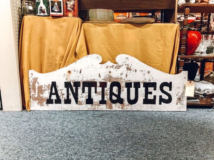 hide your tv with this diy antique sign