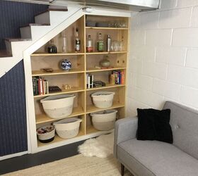 s 18 easy shelving storage solutions that will change your life, Customize a shelving unit for under your stairs