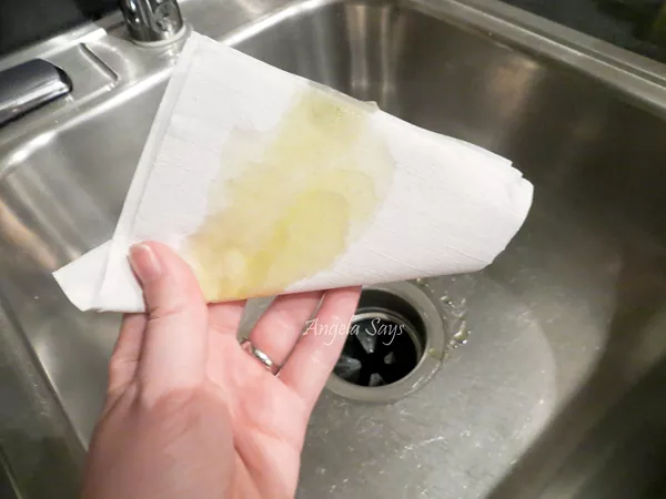 how to clean a stainless steel sink so it sparkles, paper towel covered in oil