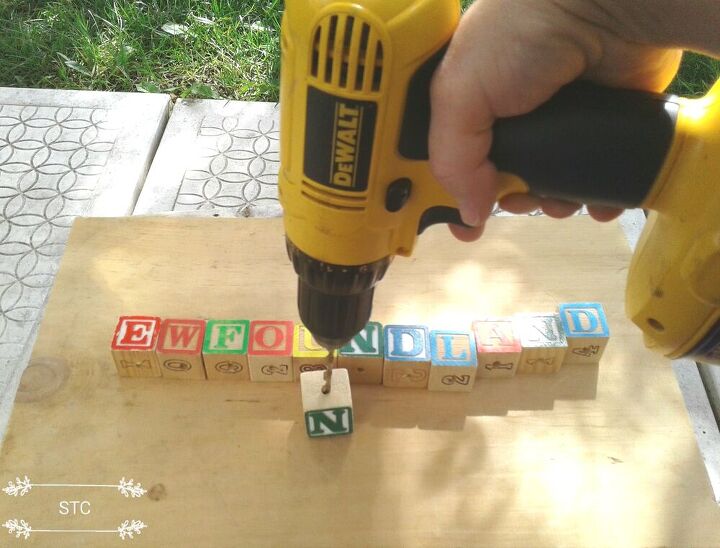 how i turned alphabet blocks and driftwood into garden decor, Drilling into the Blocks