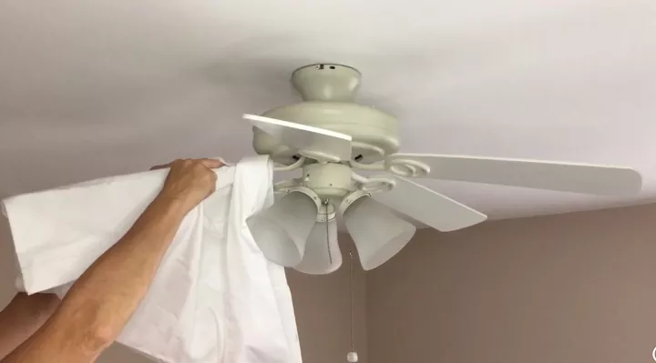 how to quickly clean your house from top to bottom, Pillowcase wrapped around ceiling fan