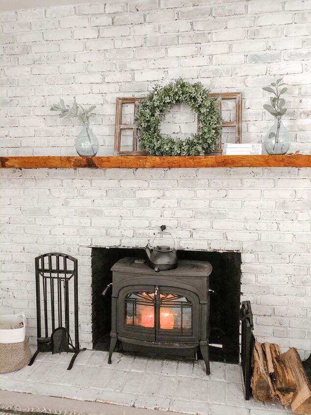 s 15 ways to update the fireplace you can t stand to look at anymore, Whitewash your brick fireplace