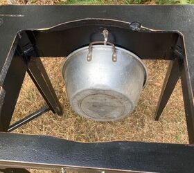 Why she hangs a bucket inside an old sewing machine table