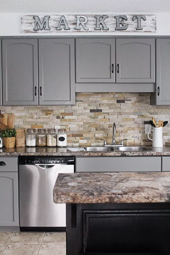 our best tips and tricks on how to paint kitchen cabinets, kitchen sink vignette with gray cabinets and stone backsplash