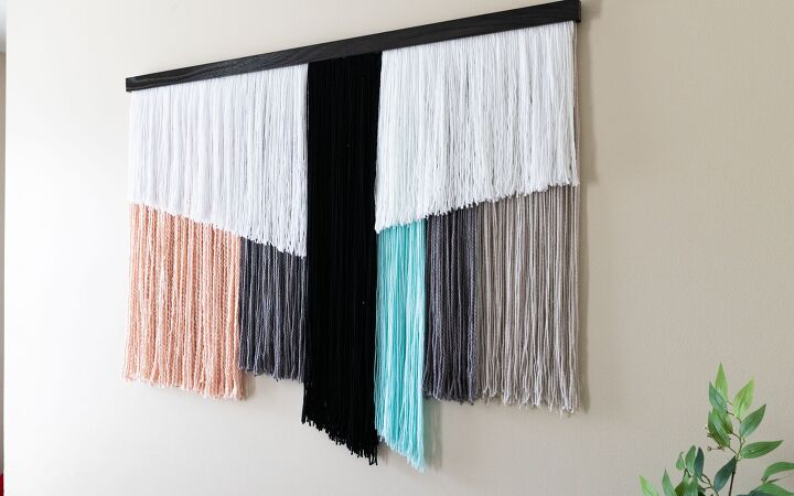 s 15 ways to make your home feel cozier this season, A giant yarn wall hanging