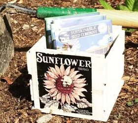 8 simple steps to your very own beautiful flourishing garden, Bags of seeds in a box with a sunflower picture