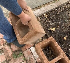 She lays cinder blocks in her yard for a brilliant fall garden idea you need to try right now