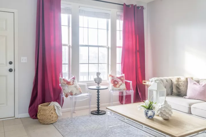 how to hang curtains like an interior designer, red curtains hanging in living room