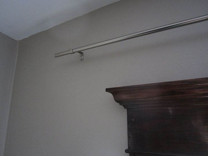 how to hang curtains like an interior designer, empty silver curtain rod above window frame