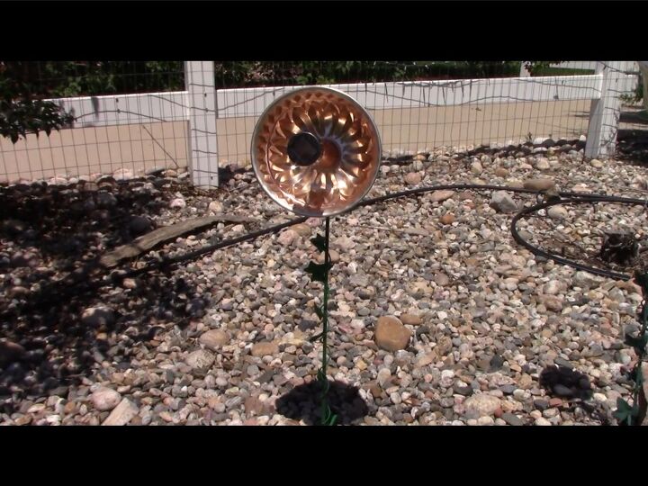s 14 fun uses for old unwanted baking pans, Her reflective solar flower