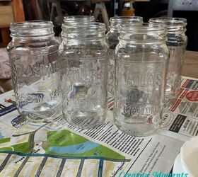 Start saving all of your leftover jars to copy this rustic and gorgeous countertop display