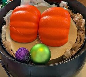 She glues ornaments to 2 foam pumpkins to create this incredible fall look