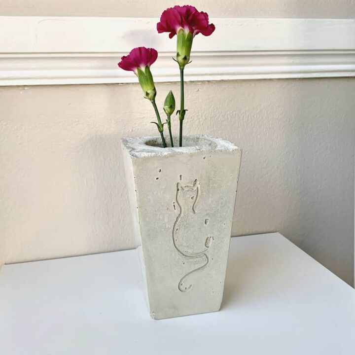 a diy cement vase with a cat design