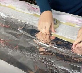 They tape tin foil to a thin blanket to copy this kid-friendly bedroom accessory