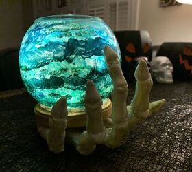 Skeleton Hand Holding Crystal Ball