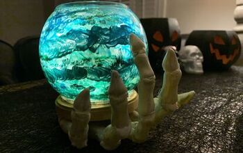 Skeleton Hand Holding Crystal Ball