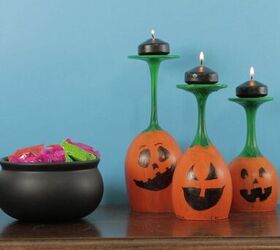 s 12 ways to turn household items into gorgeous fall pumpkin decor, Her adorable jack o lantern candle holders