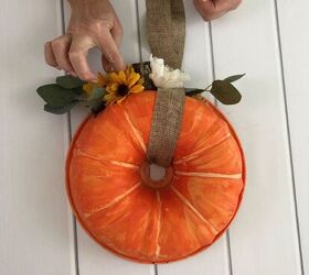 s 12 ways to turn household items into gorgeous fall pumpkin decor, A bright Bundt pan wreath