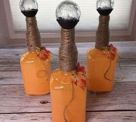 s 12 ways to turn household items into gorgeous fall pumpkin decor, These festive glass bottle pumpkin lights
